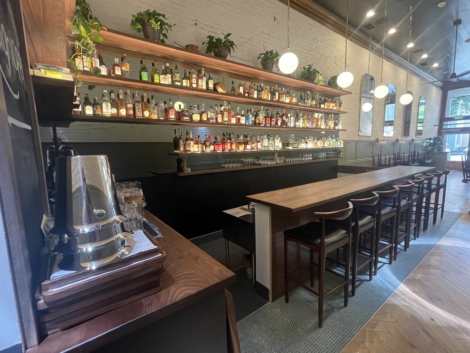 Lagniappe bar, full room view with guest seating